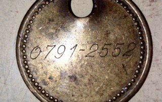 Ancien jeton de mineur numéroté et nominatif