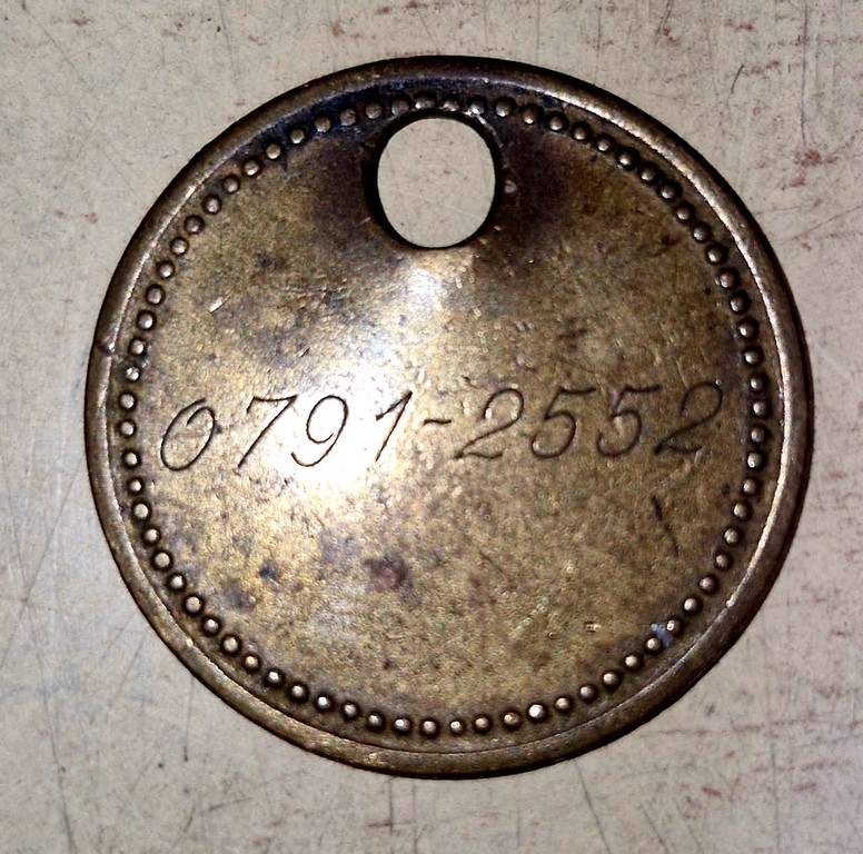 Ancien jeton de mineur numéroté et nominatif